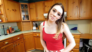 Attractive teen takes care of stepdad's boner in the kitchen