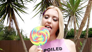 A blonde eager girl licks her lolly and she also does a threesome