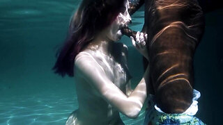 Underwater blowjob on a black rod leads to passionate fucking