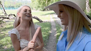 Candee Licious and Emily Belle licking in the woods