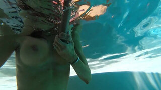 Diving in the pool and playing with a big dildo in HD