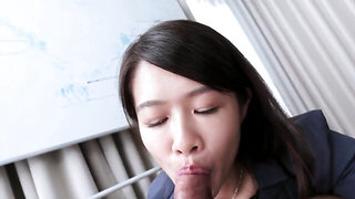 Sexy Asian woman in pantyhose gives a BJ while clothed