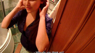 Horny dude is filming this shy chick in the bathroom