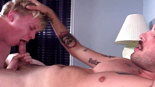 Blond fellow with a skinny figure is dominated by his buddy