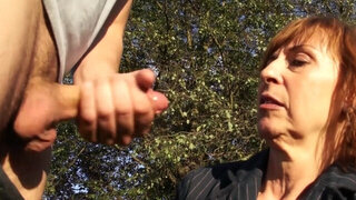 Mature redhead gives head in public and likes being taped