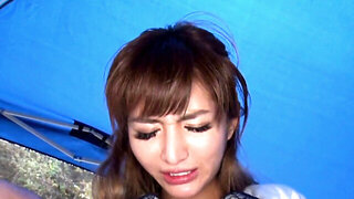 Asian slut Nozomi Aso takes on two dicks at the beach