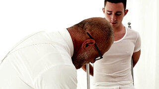 Suited DILF is playing with the girthy cock of a teen