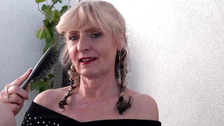 Mature woman with a saggy body fucks herself with a dildo