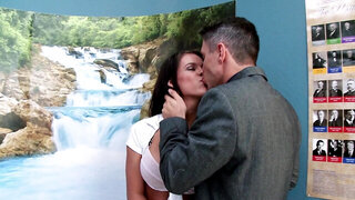 A brunette with large tits is getting fucked in the school classroom