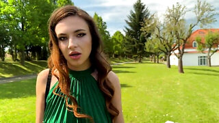 Redhead in a field, giving a Bj before doggy style