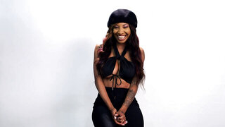 Attractive black babe spreads legs and plays with wet pussy