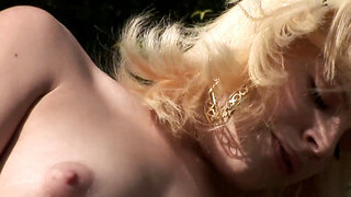Blonde with soft nipples rides dick outside on the grass