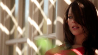 A solo girl is doing a hot striptease before the camera lens