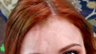 Redheaded beauty is going to seduce in see-through garb