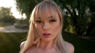 Amber Moore stripping naked in an outdoor setting