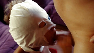 A blonde that has a mask on is getting anally pounded hard