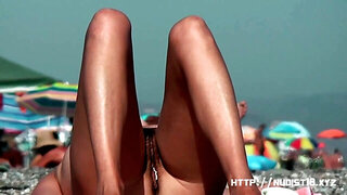 Bitch at the beach getting horny nudist pussy wet