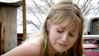 Skinny teen seductively massages trimmed peach near cabriolet