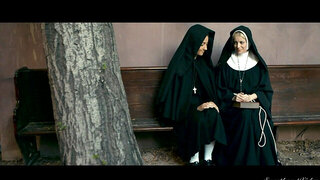 Sexy nuns are playing with each other in front of the camera