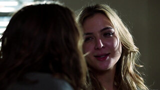 A blonde with nice looking tits is getting spooned on the bed