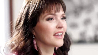 MILF in stockings poses for the camera to a nerdy lad