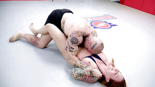 Tattooed redhead with a great ass wrestling a tall man