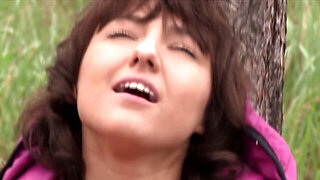 Suzy Rainbow takes on Daphne J in the rain, in the woods