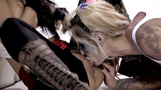 Wearing masks and makeup, these two are into some lesbian fun
