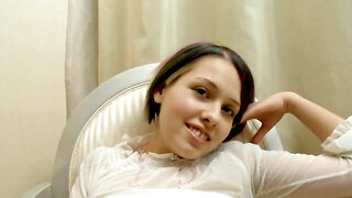 Cute girl Zanna spreads legs and masturbates on the chair
