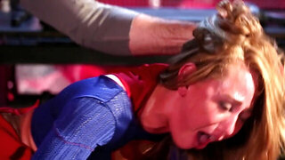 Supergirl gets nailed on table by hung Batman