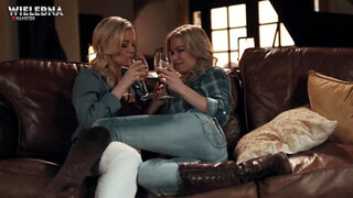 Two blondes passionately make love in living room