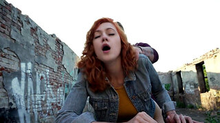 Redheaded girl wtih a cute face gets fucked outside