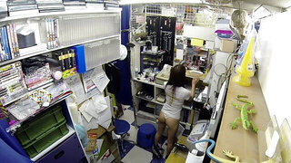 Horny minx from Japan masturbates pussy in sex shop storeroom