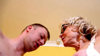 Ancient blonde GILF with glasses takes a cock from a young dude