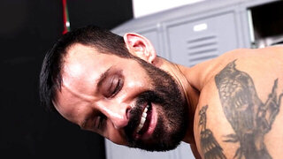 Tattooed lad is getting licked and banged in the locker room