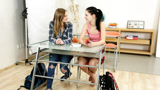 Two white teens double team a nerdy looking black guy