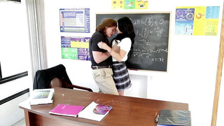 A brunette with long hair is getting penetrated on the desk
