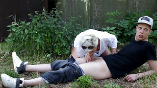 Short-haired MILF sucks and rides young cock outdoors