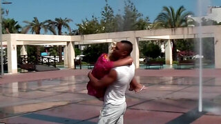 Russian blonde allows black man to play with her tits outdoors