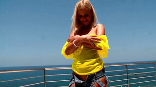 Attractive blonde with a nice ass is fingering herself