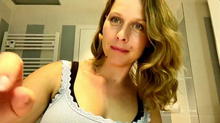 Ugly mom fondles her boobs while putting her make up on