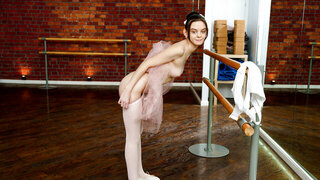Tiny Ballerina Puts Her Hands Down Her Skirt To Her Hot Pussy
