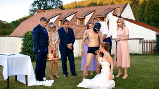 A man in a dog mask is fucking the bride while outside