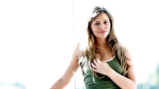 Two girls are kissing one another while they are riding a large dick