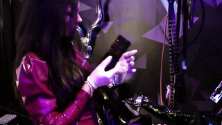 Gimp in latex is being milked by a dirty brunette mistress