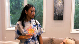 Blonde and ebony babe in a lesbian action on the floor