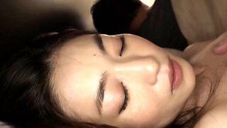 Horny Asian Woman Fingers Her Pussy While Her Husband Rests