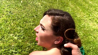 Redhead in a field, giving a Bj before doggy style