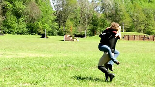 Horsewoman says good night to man and then they turn to kiss