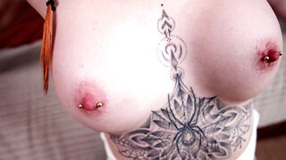 Redhead with pierced nipples sucks and fucks a dildo